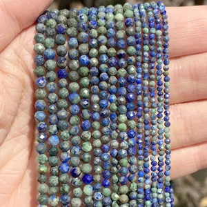 Detailed view of faceted blue and green natural stone beads in various sizes