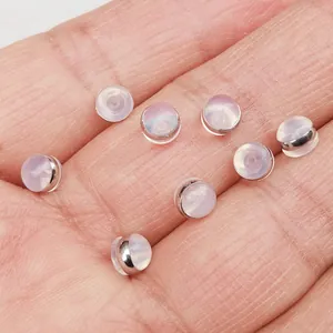 Close-up detail of clear silicone hamburger-style earring backs for DIY jewelry making