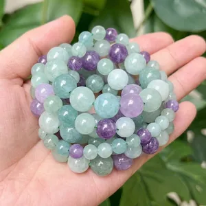 Close-up shot of natural mixed green and purple fluorite chalcedony beads for DIY jewelry