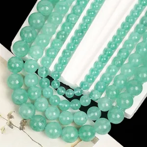 Detail view of light green angelite stone beads in various sizes for DIY jewelry making.