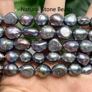 Macro detail of iridescent 10-11mm black baroque pearls showing natural luster