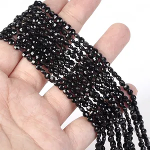 Close-up of 4mm faceted black natural stone round disc beads for jewelry making