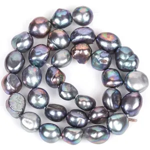 Close-up view of 10-11mm black iridescent baroque pearls with glossy finish for DIY jewelry.