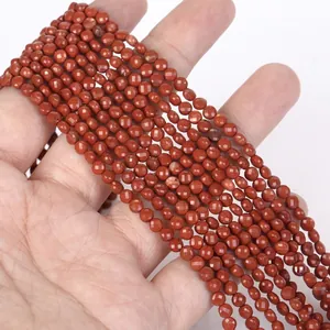 Close-up of 4mm faceted natural red jasper stone disc beads for professional DIY jewelry making