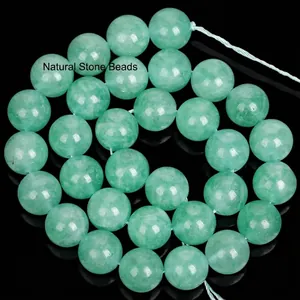 Close-up of translucent green fluorite stone beads for DIY jewelry making and craft projects