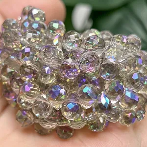 Detail view of 6mm faceted iridescent strawberry crystal beads with a rainbow AB coating.
