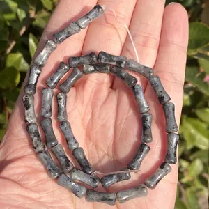 Detail view of 5x12mm bamboo-shaped natural labradorite stone beads for DIY jewelry making.