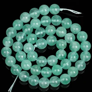 Macro view of high-quality natural green angelite round beads for DIY jewelry making.