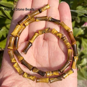 Macro view of 5x12mm bamboo-shaped natural tiger eye stone beads for DIY jewelry making