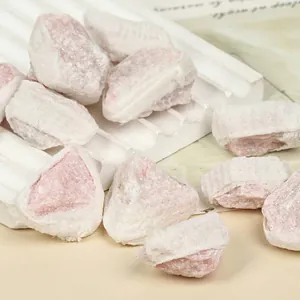 High-quality macro view of natural raw pink opal mineral stones on a display stand