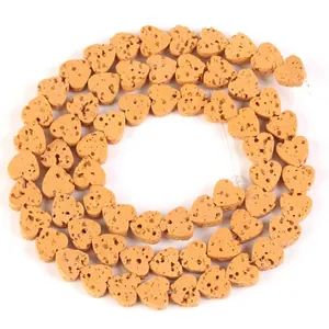Macro detail of heart-shaped natural volcanic stone loose beads for DIY jewelry making