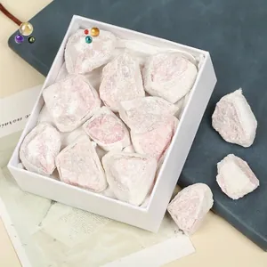 Natural raw pink talc opal stones presented in a white gift box for collection