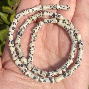 Detailed view of 5x12mm natural Dalmatian jasper bamboo shaped beads for DIY jewelry making