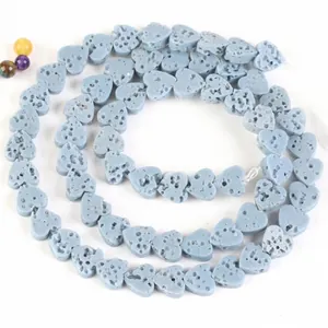 Detail view of heart-shaped blue volcanic stone beads for DIY jewelry crafting projects