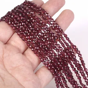 Close-up of 4mm faceted red natural stone beads for DIY necklace and bracelet crafting