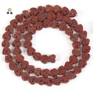 Detailed view of heart-shaped natural red lava stone beads with porous texture