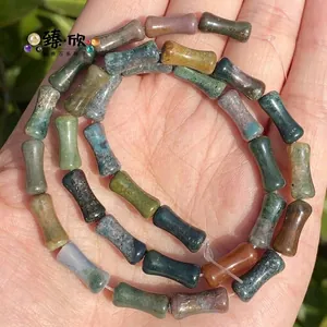 Detailed macro view of 5x12mm bamboo-shaped natural chalcedony and agate mixed stone beads.