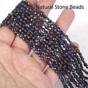 Close-up of 4mm faceted natural blue stone spacer beads for DIY jewelry making projects