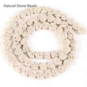 Close-up detail of porous heart-shaped natural beige volcanic stone beads for DIY jewelry