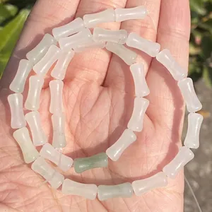 Close-up of 5x12mm natural bamboo joint jade beads, semi-transparent white and green