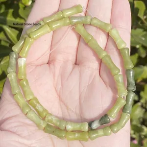 Close-up of 5x12mm bamboo-joint shaped natural pale green stone beads for DIY jewelry