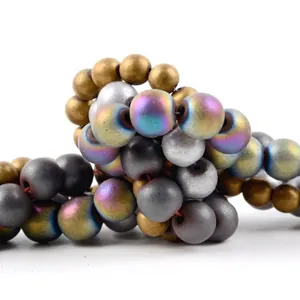 Close-up of matte electroplated hematite beads in various metallic and rainbow finishes