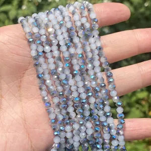 Detailed macro view of faceted iridescent blue glass beads for DIY jewelry making