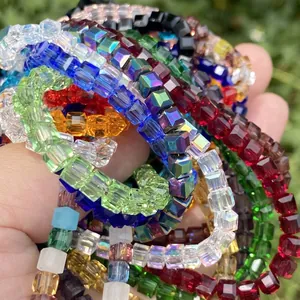 Macro view of multi-colored faceted square crystal glass beads for DIY jewelry