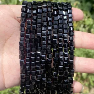 Macro view of faceted black crystal glass cube beads for DIY jewelry making crafts