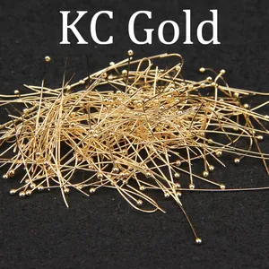 Detailed view of KC gold plated pure copper ball pins for DIY jewelry making.