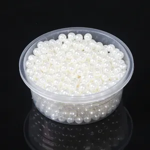 Detailed view of white ABS imitation pearls for DIY jewelry making and crafts