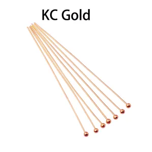 Detailed macro shot of KC Gold copper round head ball pins for DIY jewelry making crafts