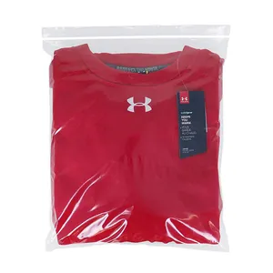 Clear PE plastic self-sealing zipper bag showing a folded red shirt inside for scale