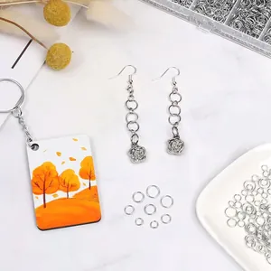 Close-up of silver metal jump rings for DIY jewelry making and earring assembly
