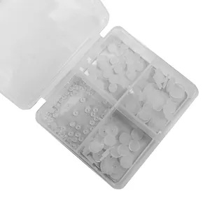 Set of clear silicone earring spacers and backs in a four-compartment plastic storage box