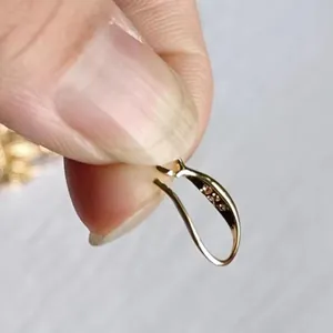 Detail view of a 18K gold-plated ear hook for handmade DIY jewelry components.