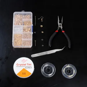 DIY jewelry making kit with pliers, tweezers and various earring accessories on black background.