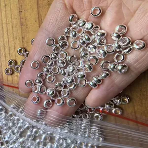 Close-up of shiny silver-toned large hole spacer beads for DIY bracelet jewelry making