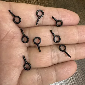 Close-up of black metal screw eye pins for DIY jewelry making accessories