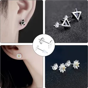 Macro detail view of flat stud earring posts with metal and silicone butterfly backs