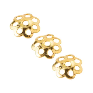 Detail view of 6mm 18k gold plated hollow daisy flower bead caps for DIY jewelry making.