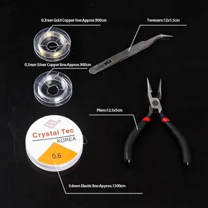 Detailed view of jewelry making tool kit with pliers, tweezers, copper wire, and elastic cord