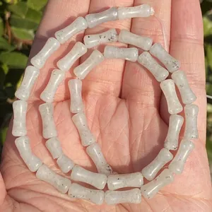 Close-up view of 5x12mm natural bamboo-shaped grey stone beads for jewelry making