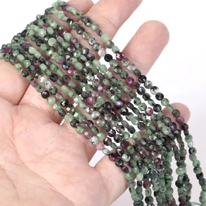 Close-up of 4mm faceted natural Ruby Zoisite spacer beads for DIY jewelry making.