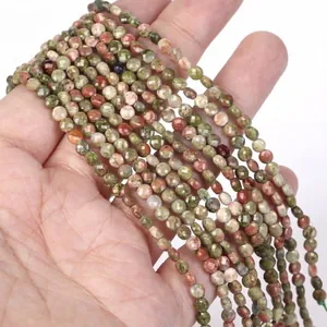 Close-up view of 4mm faceted Unakite natural stone beads for DIY jewelry making