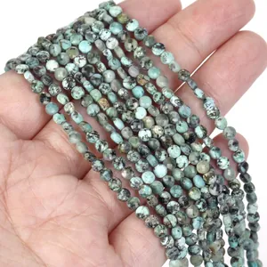 Close-up of 4mm faceted turquoise-colored natural stone disc beads for DIY jewelry making