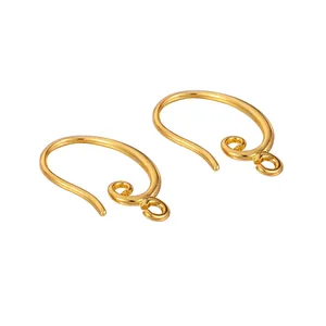 Detailed view of gold-colored retro earring hooks for DIY jewelry making.