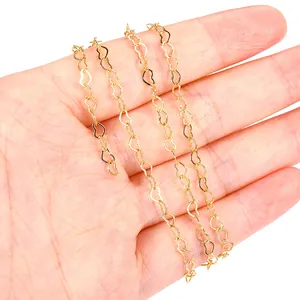 Close-up detail of 18K gold-plated heart-shaped chain link necklace