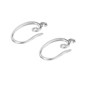 Detailed macro view of silver-tone spiral earring hooks for handmade DIY jewelry making