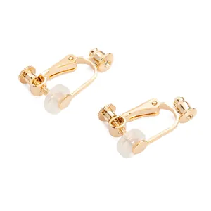 Close-up of gold-plated screw-back earring converters with clear silicone pads
